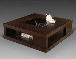 square center table in dark coloured wood