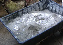 Mixing Cement, Water, Sand, Fibre and Water proofing Compound
