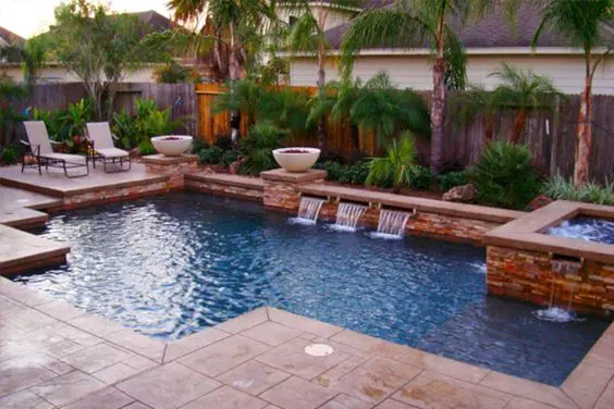 Decking - seating zone created with stone next to pool