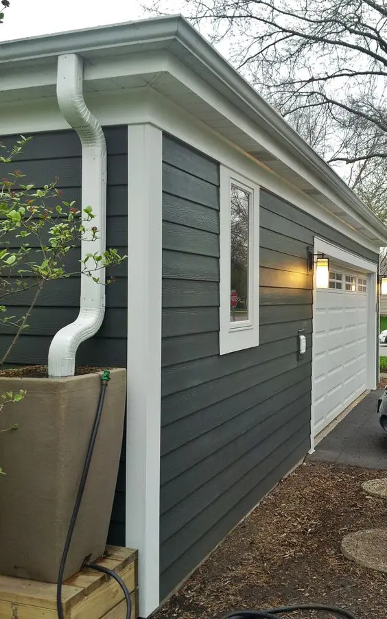 Fiber board claddding on exterior walls of house