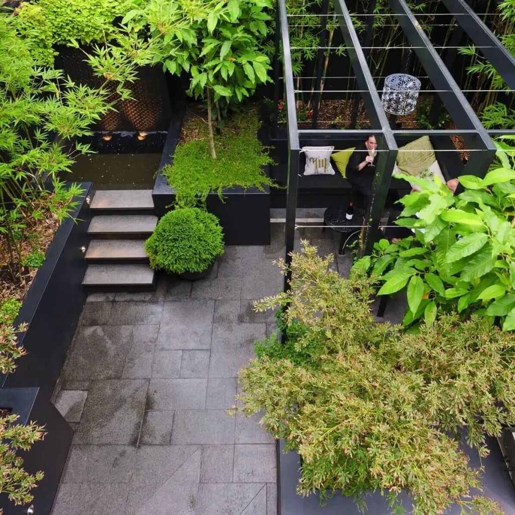 Courtyard with a small pool trees and seating area