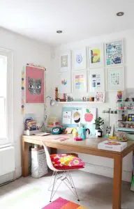 Study table with colouful posters placed on the wall