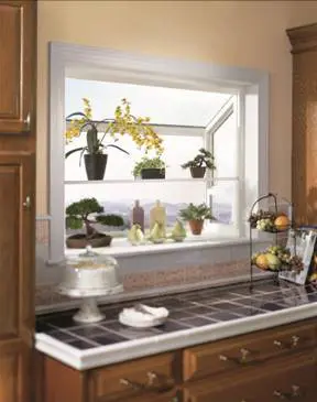 Potted plants installed in shelves made in kitchen window