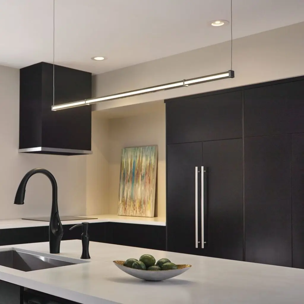 Pendent light hanging above the island kitchen area