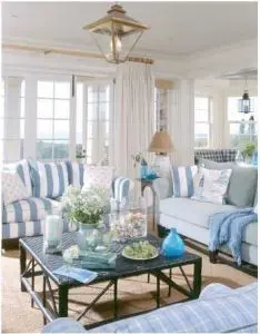 blue and white striped upholstery on sofas in costal fashion apartment