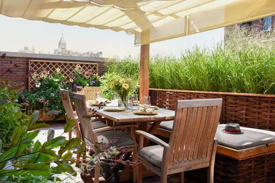 roof top covered with awning and with a dining table