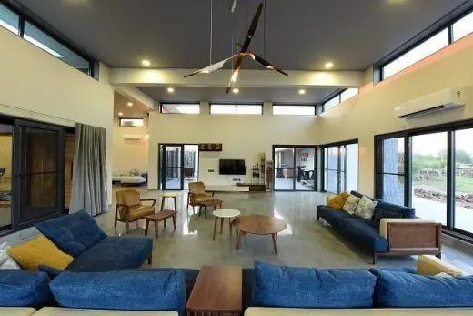 double heighted living room in a weekend home with minimal furniture
