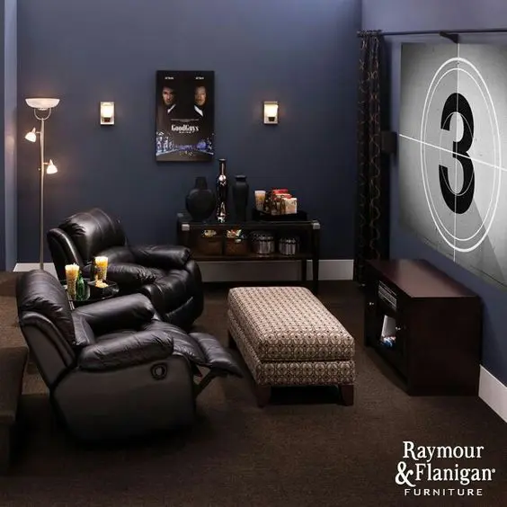 2 recliners with a movie display entertainment den