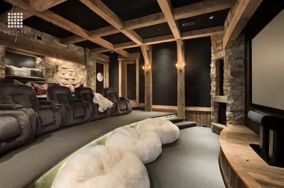 A Rustic Designed Home theatre with recliners and bean bags