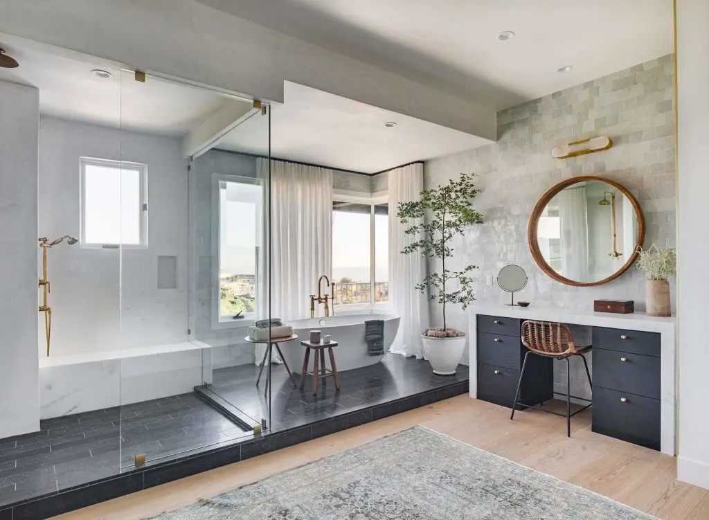 Bigger bathroom space with open glass partitions