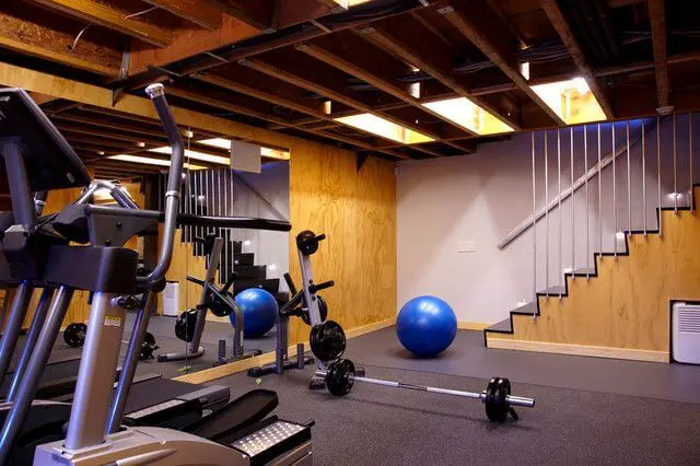 House gym in basement area with natural lighting from ceiling