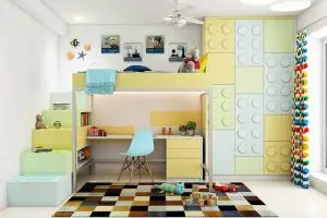 A bunk bed with lego shaped storage and study table below