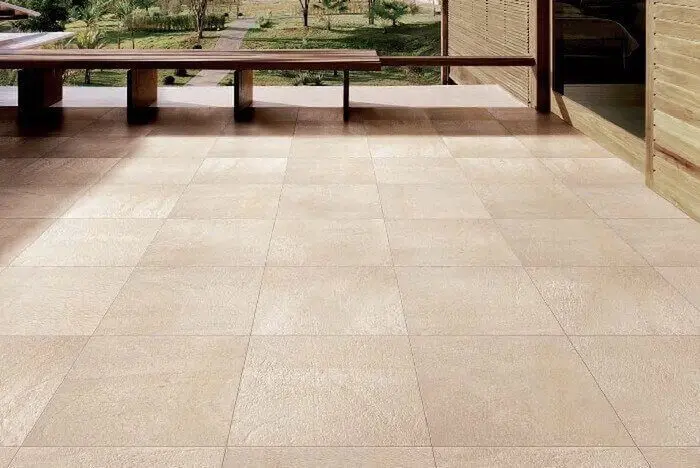 Ceramic tile in balcony with a wooden bench