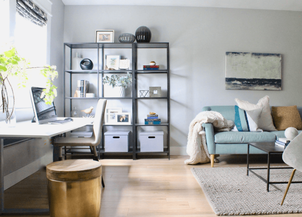 Living room with open storage and work desk