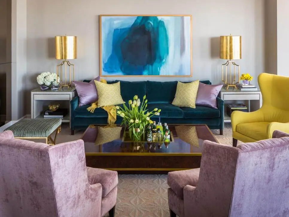 A dining room with wall painting and sofa set