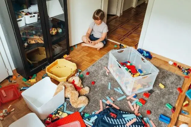 cluttered child room with lots of toys and things