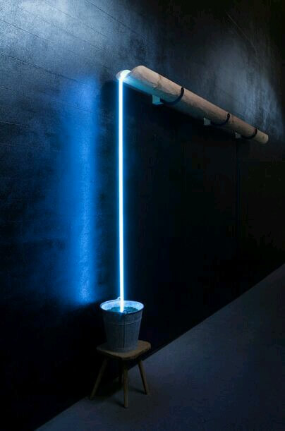 Concept lighting like water flowing from a pipe to bucket