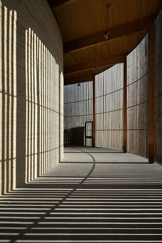 Shadows created by wooden walls in passage