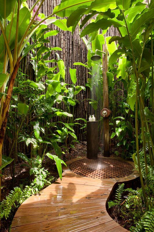 Bathroom designed in greenery and admist a garden