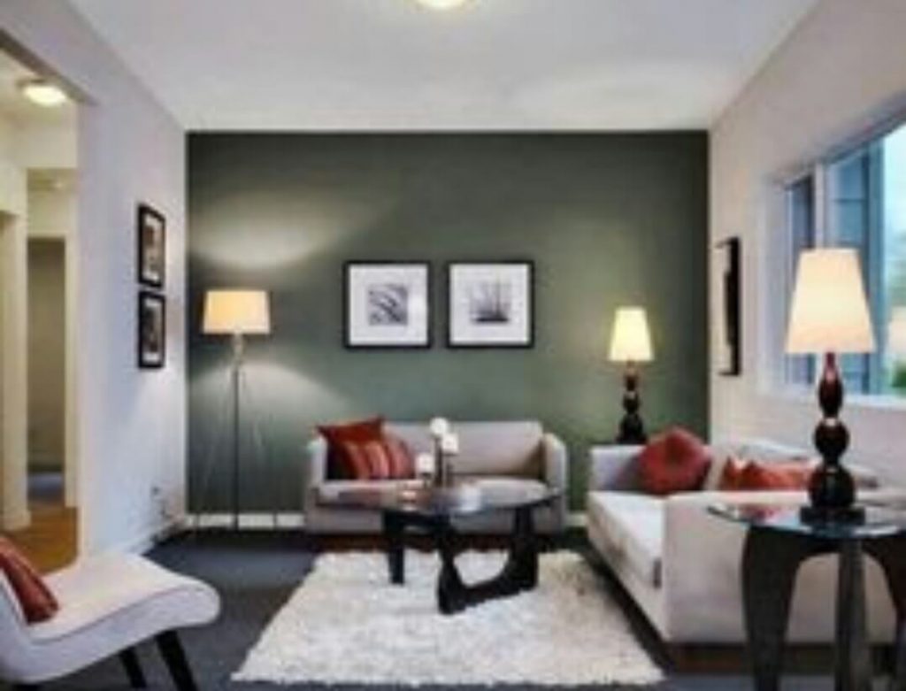 A feature wall made in green in the living room