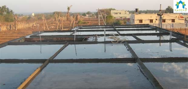 Curing of concrete by creating water ponds