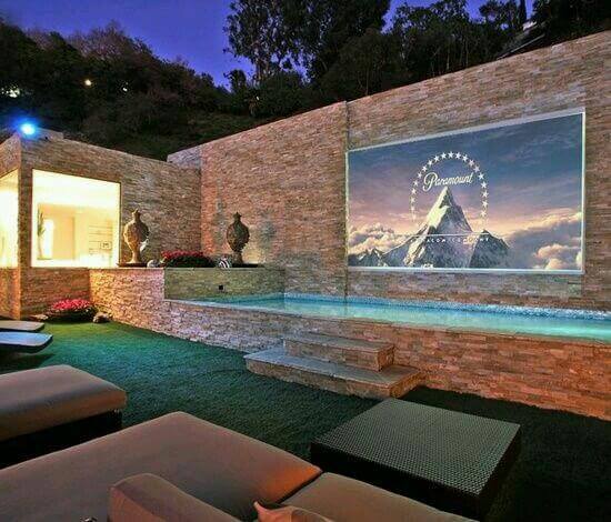 A backyard theater with sofas