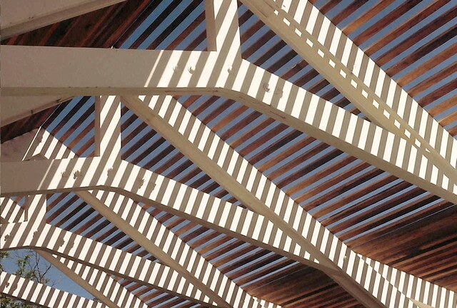 Shadow pattern created on truss by wooden ceiling