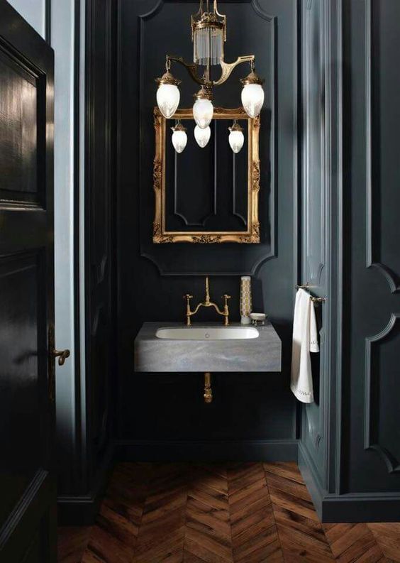black and gold color wash basin and mirror area