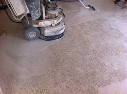 Griding the Mosaic Flooring using machine using carborundum stones