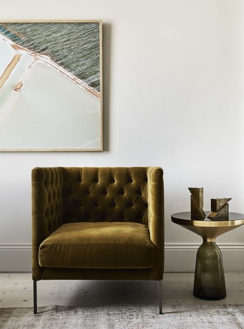 Sofa with a touch of metallic and brown that goes with gold colour interiors