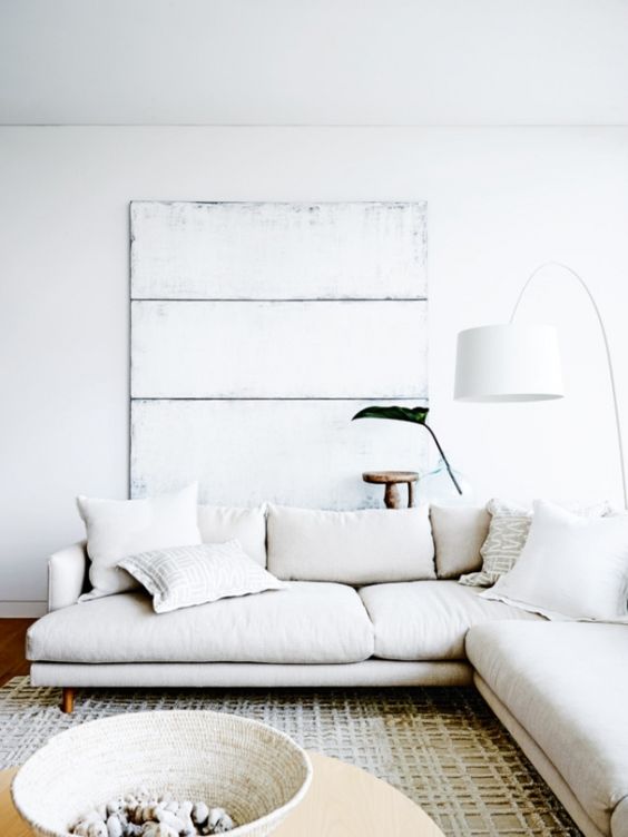 Living room interiors with sofa, walls and lighting in white