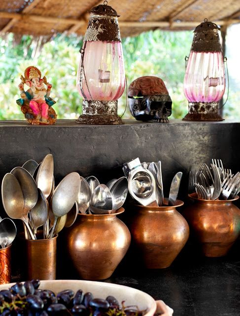 Using copper vessels and latern lights to give a vintage look to kitchen