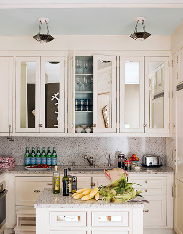 Mirrors on Cabinet shutters in Kitchen