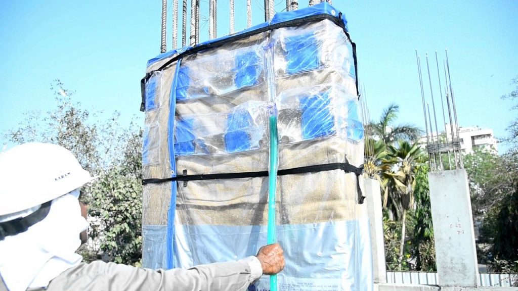 Plastic Wrapping of Coloumn to Conserve Water in Construction