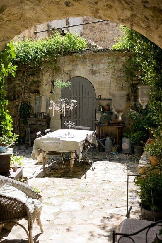 Italian Style Courtyard design with a dining table in center
