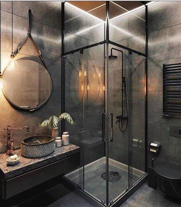 round mirror suspended by rope from ceiling in a dark bathroom along with shower unit