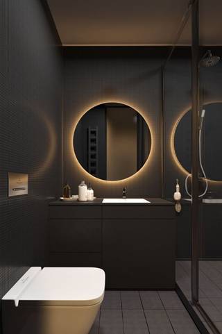 round mirror with back lighting placed above wash basin in dark bathroom