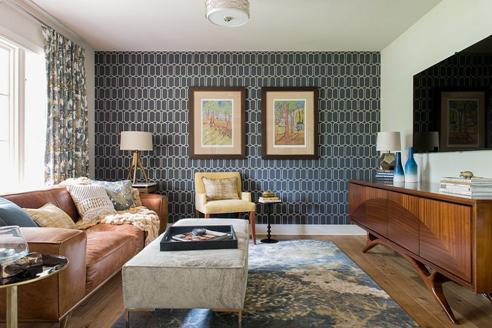 Accent wall created by pasting geometric wall papers and photoframes
