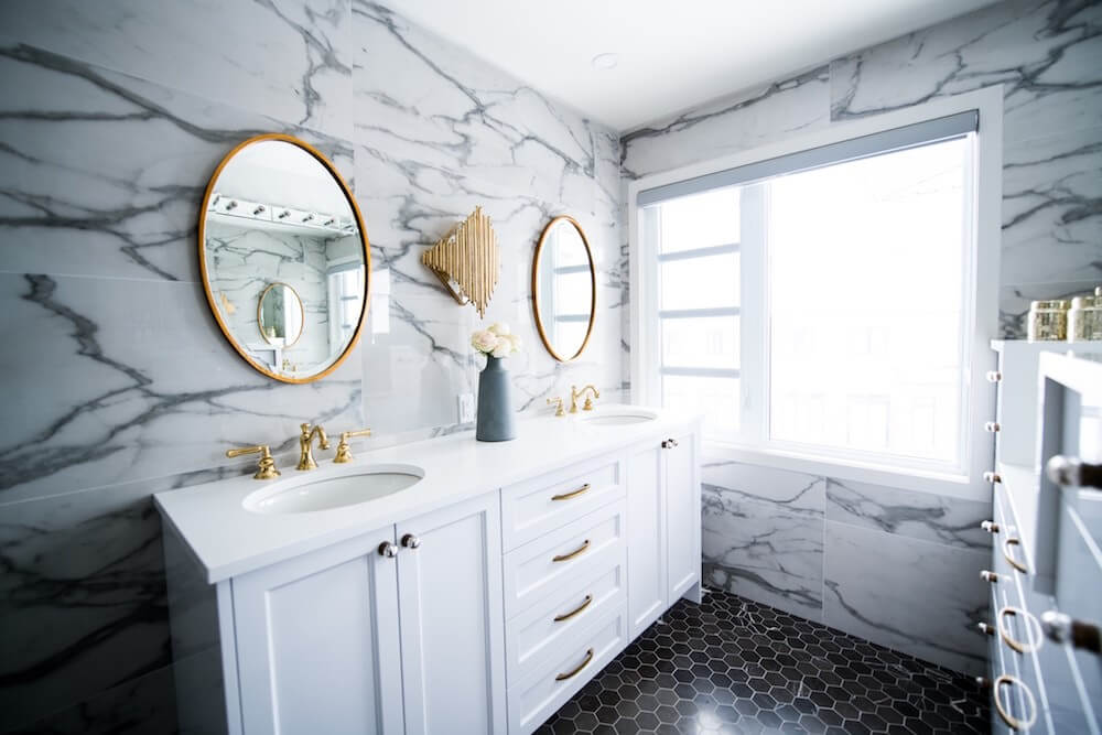 Golden colored bathroom fittings and mirror borders