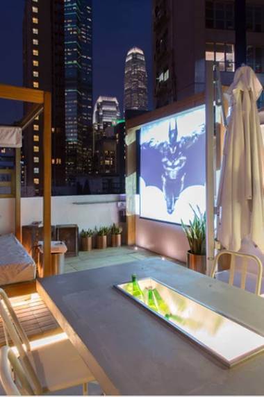 Movie screen on the roof top of a house