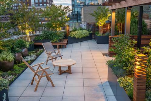 Plants, lights and seating placed on terrace