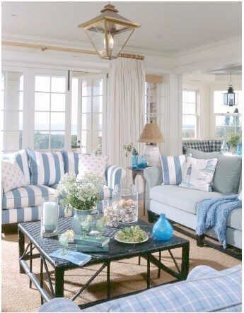blue and white striped upholstery on sofas in costal fashion apartment
