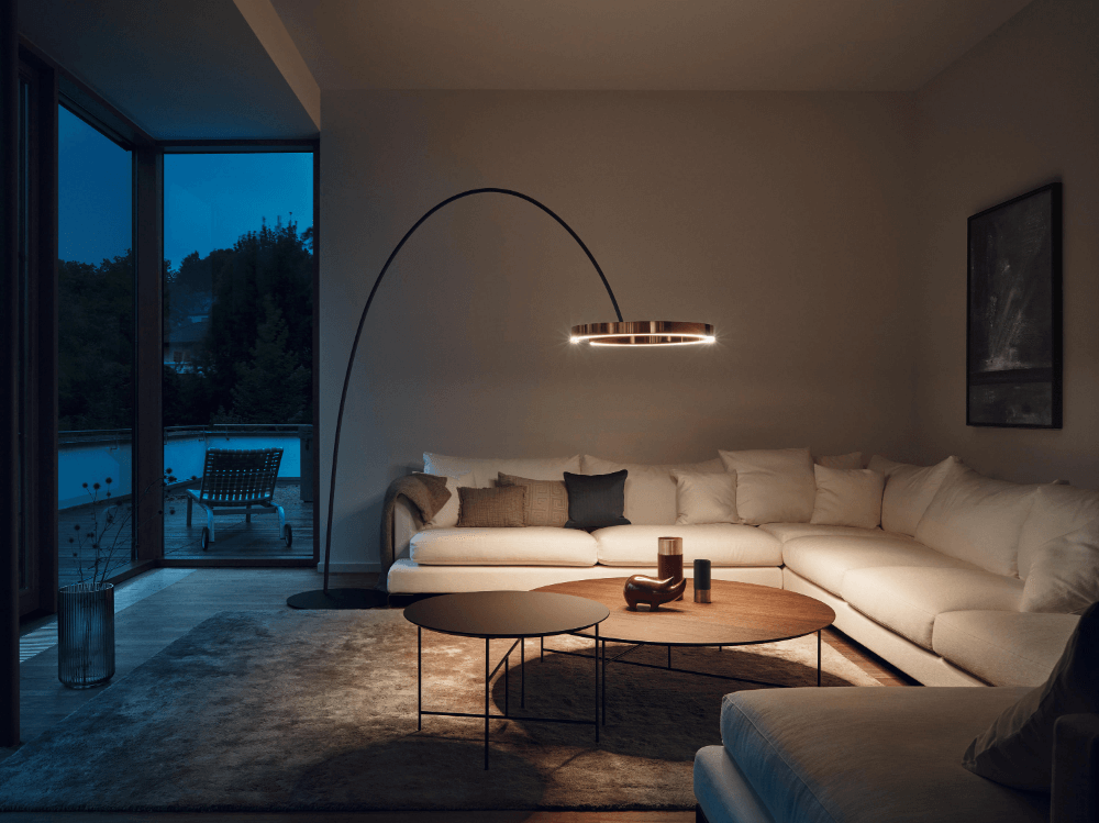 floor lamp focused on sofa and coffee table area in living