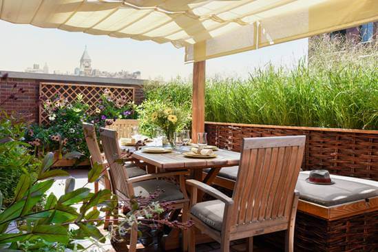 roof top covered with awning and with a dining table