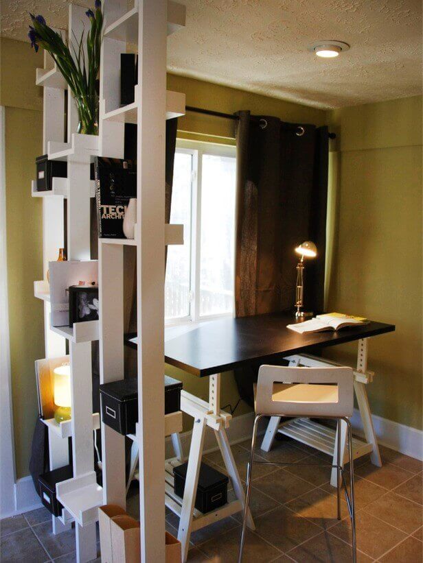 A book shelf used as a partition for home office