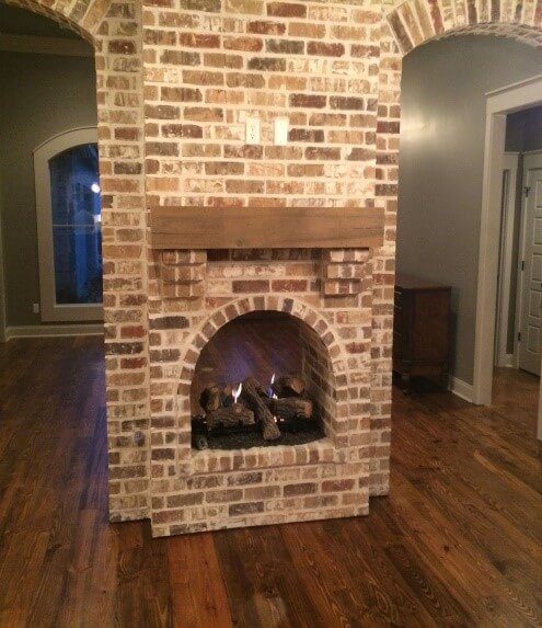 Arch partition around the fireplace