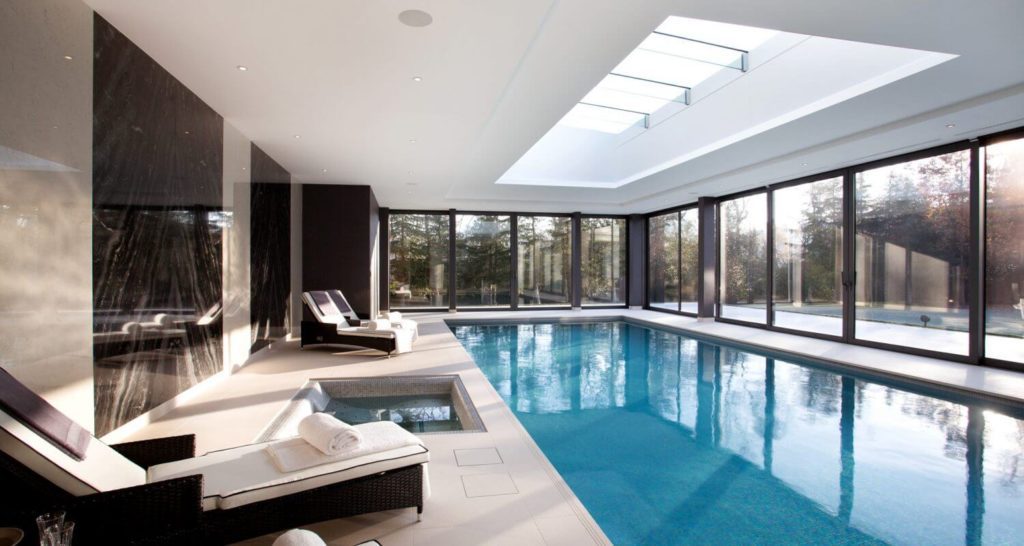 Indoor Swimming Pool with Seating and walk area