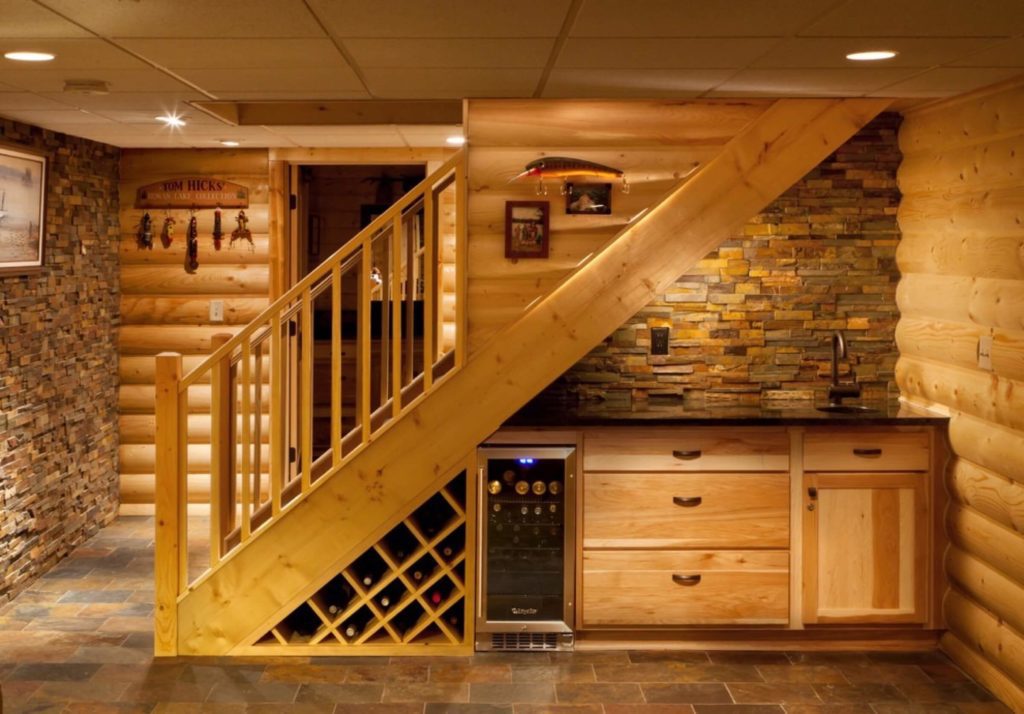 Staircase to basement with wine cellar underneath and finished in wood