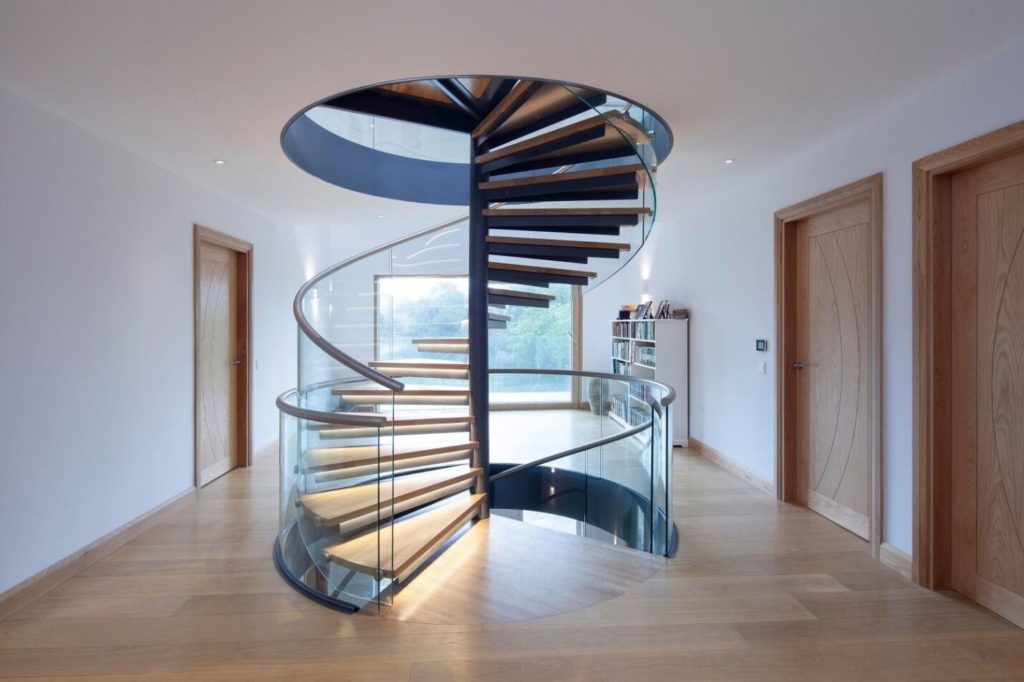 A elegant spiral staircase with toughened glass railing