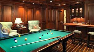 A pool table installed in basement area of a house